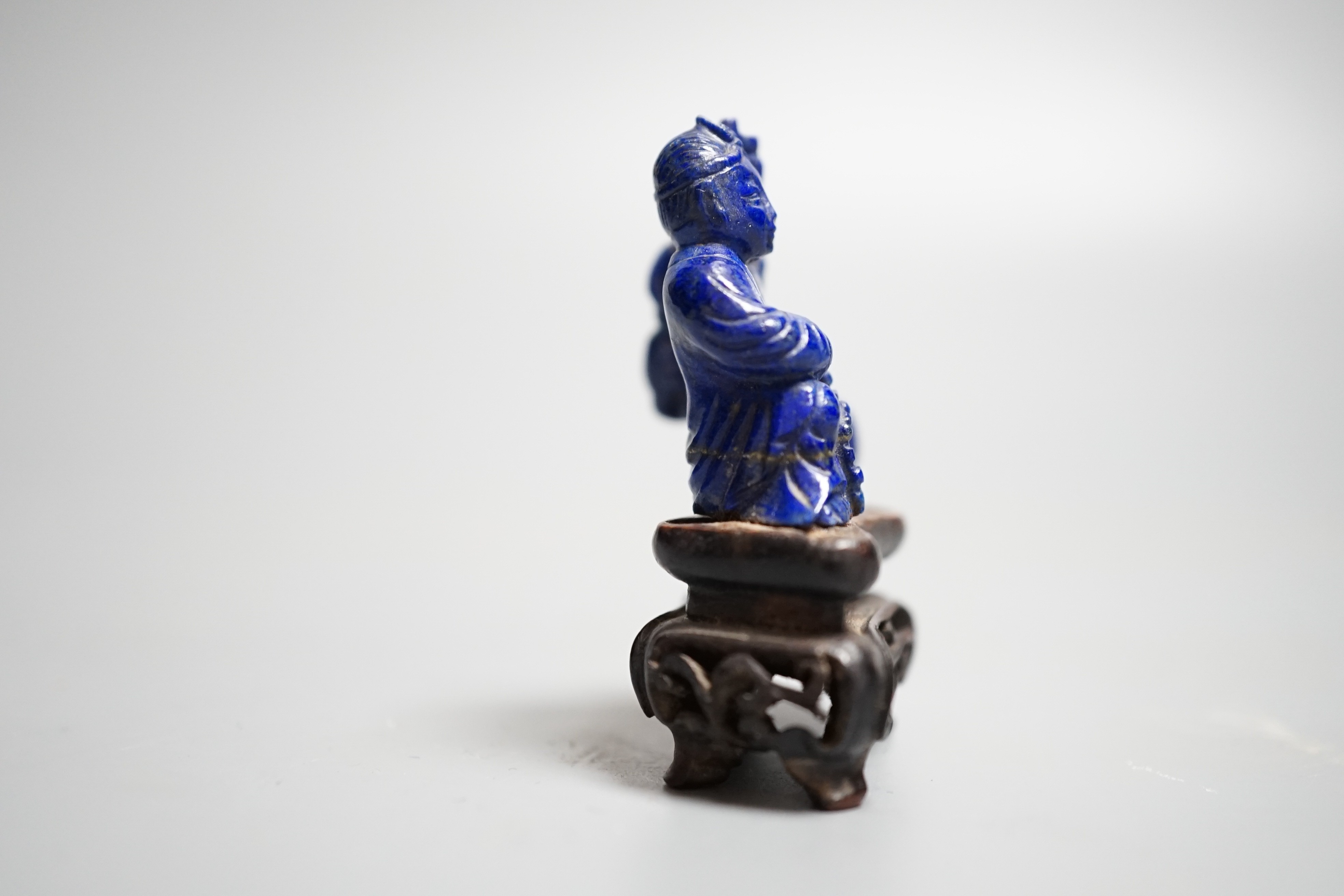 A Chinese carved lapis lazuli model of a Buddha, height 5.5cm (a.f.)